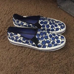 Blue, black, and white Kate Spade Keds.